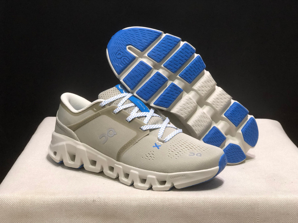 On Running Cloud X 3 in Glacier/White colorway showing side profile and outsole with blue CloudTec pods